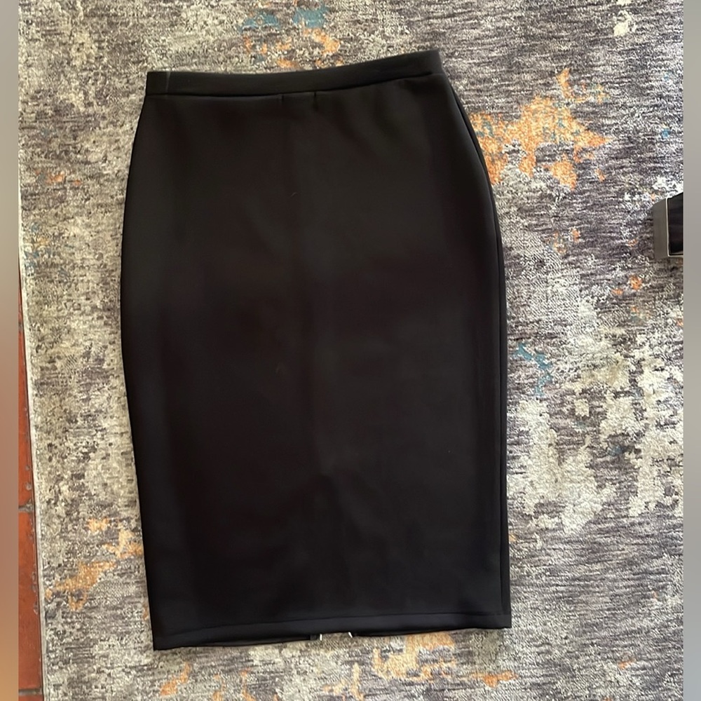 Straight black skirt with two way zipper.